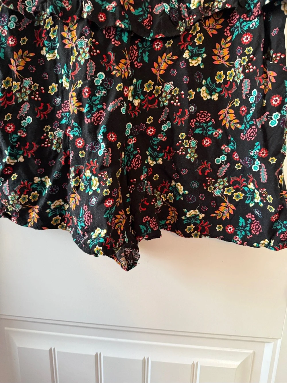 Gently worn Black Floral Ruffled Waist Sleeveless Romper